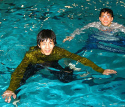 pool lifeguard swimming in uniform clothes